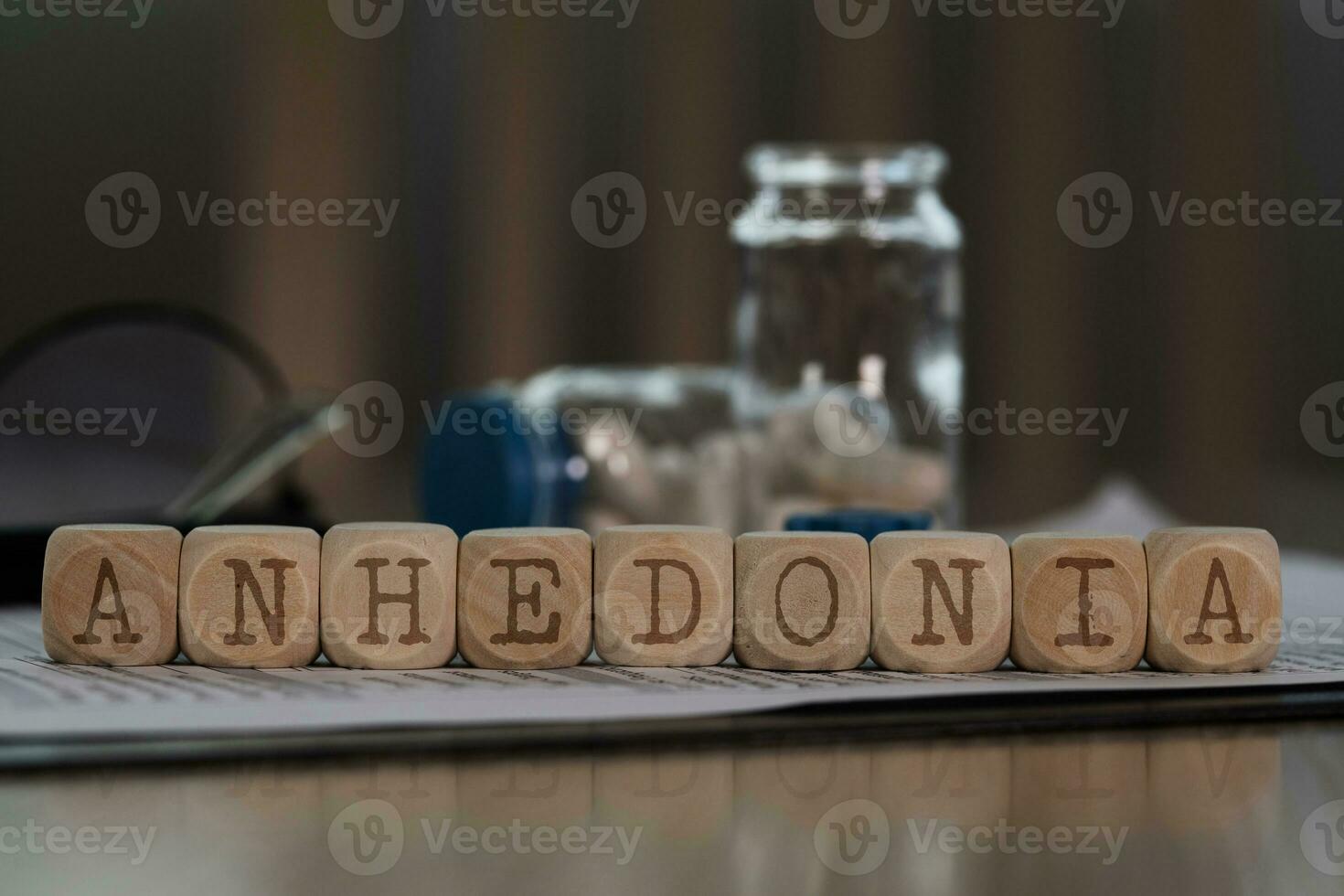 Word ANHEDONIA composed of wooden dices. photo
