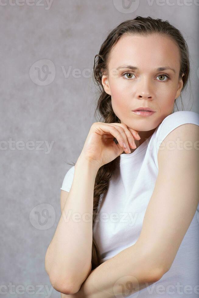 Young lady with long hair. Closeup. photo