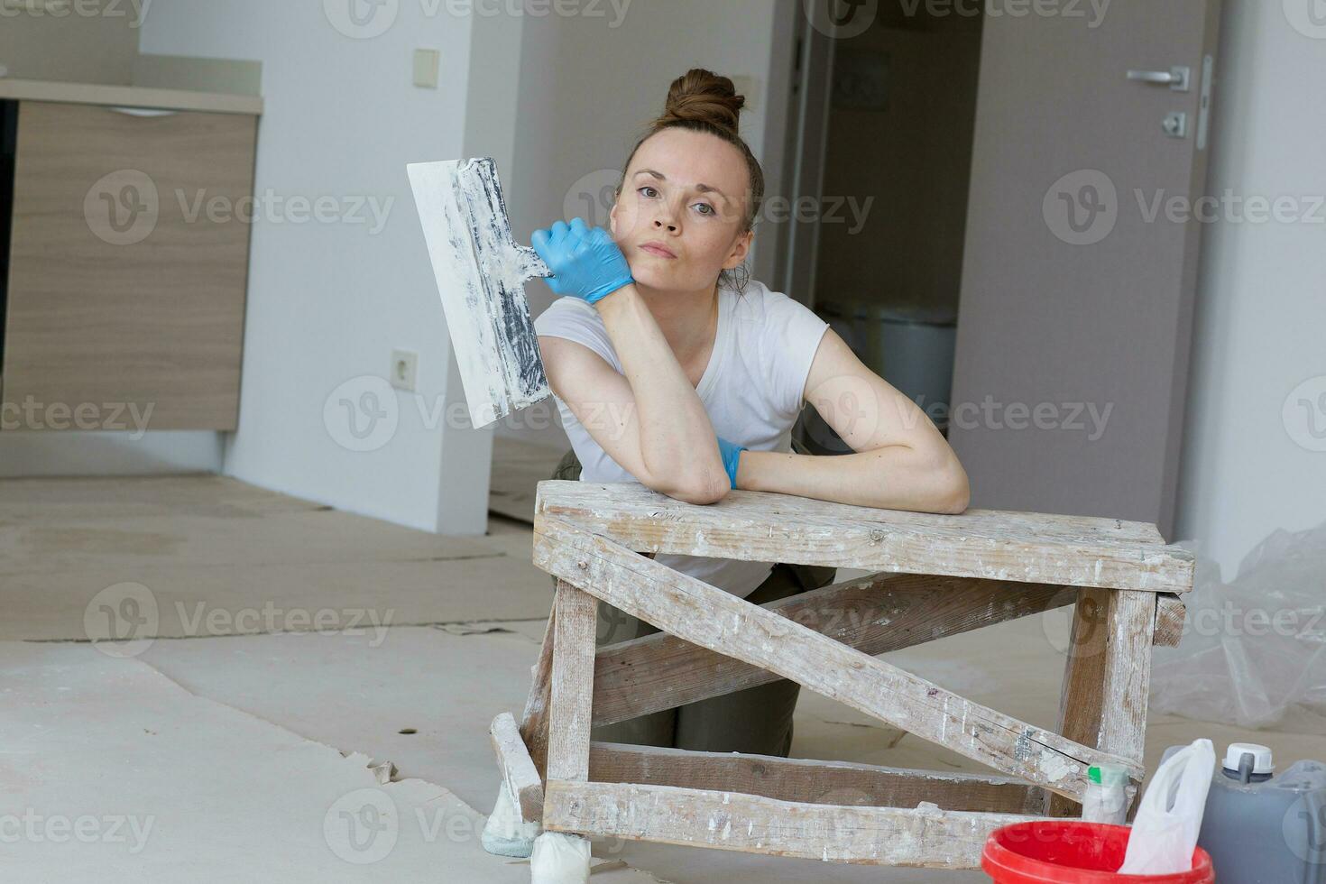 Young lady renovates  apartment photo