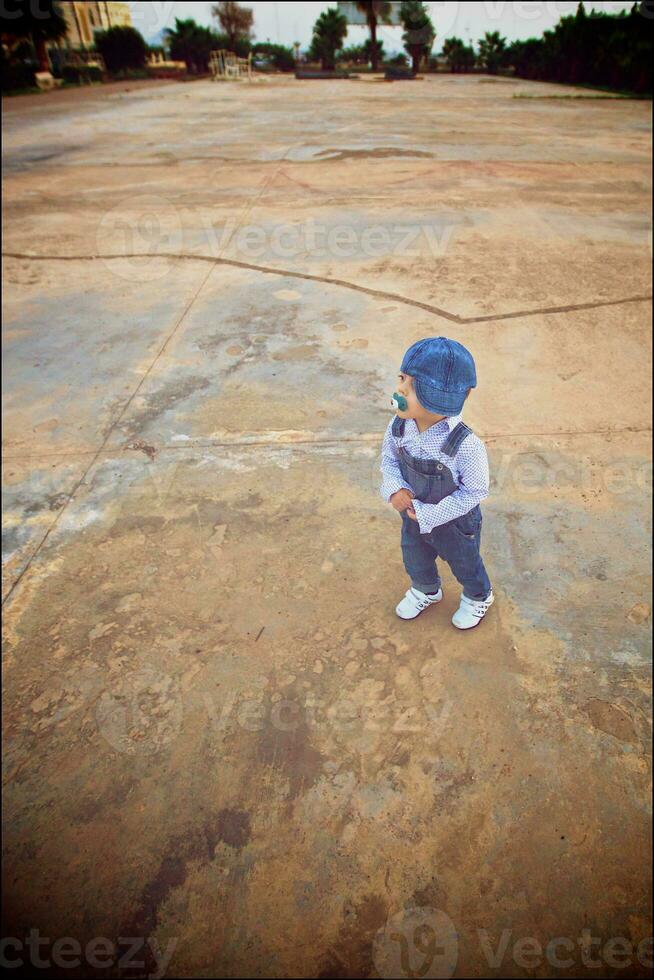 Boy of one year stays alone. Wide angle photo