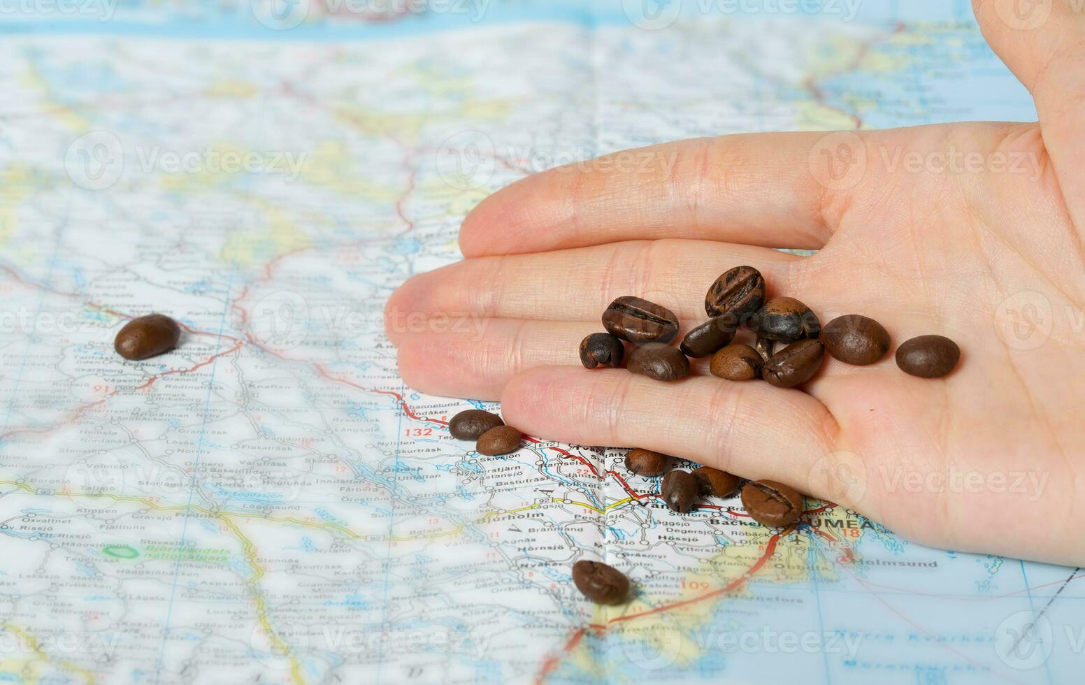 Coffee beans on a map. Closeup photo