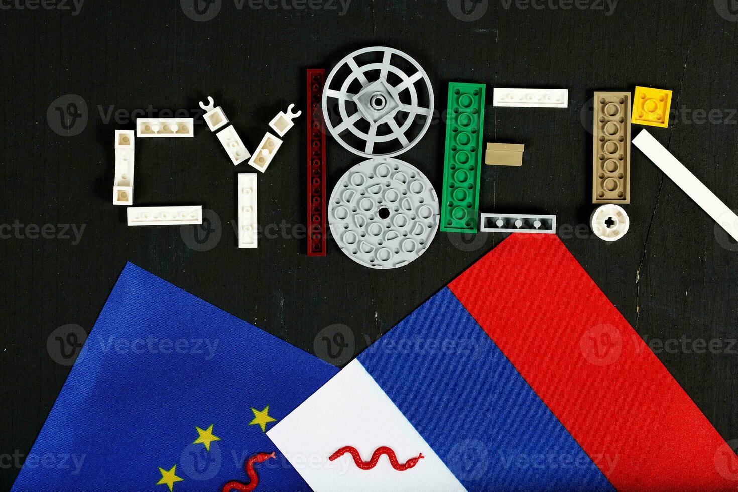 Cyber attack is composed of plastic mini block on a black surface.Background photo