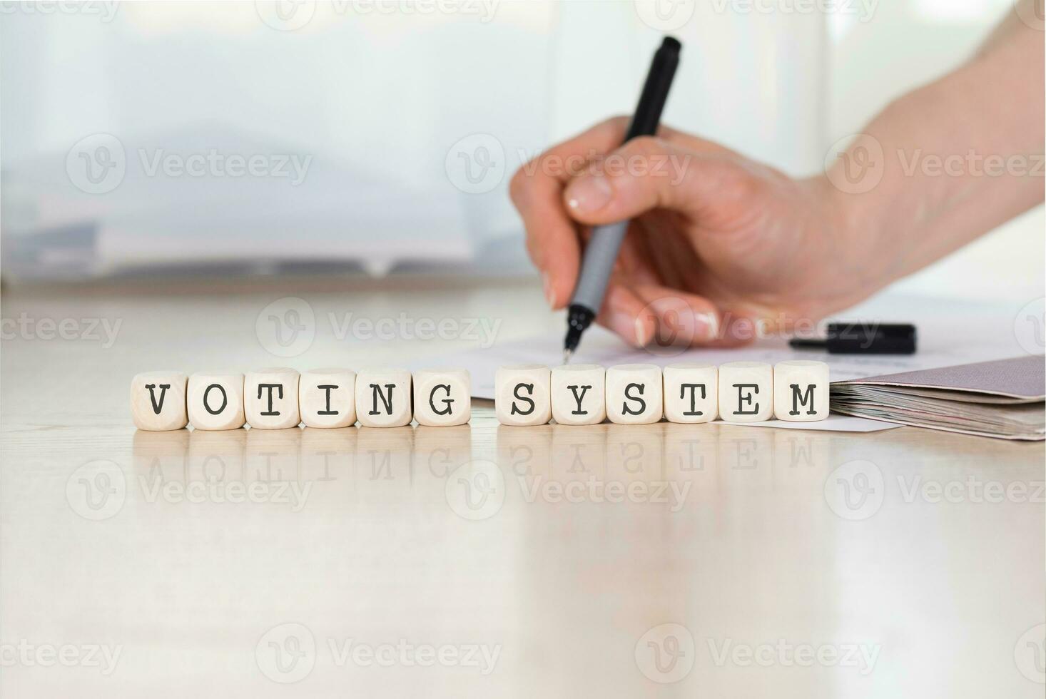 Word VOTING SYSTEM composed of wooden letter photo