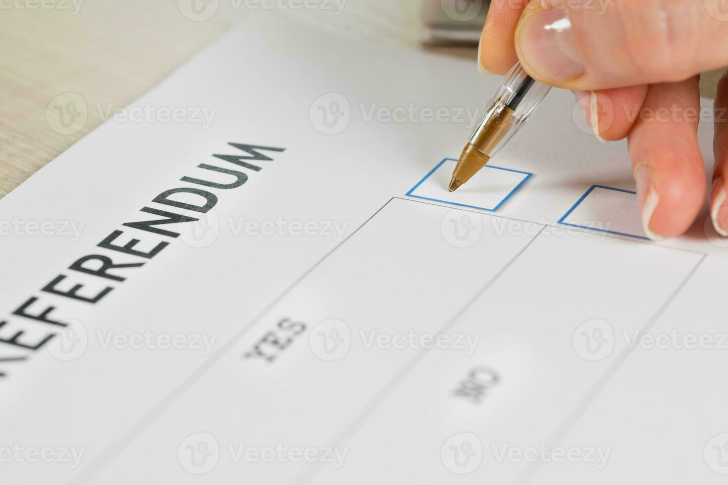 Referendum ballot paper, black pen, and passport on the table. photo