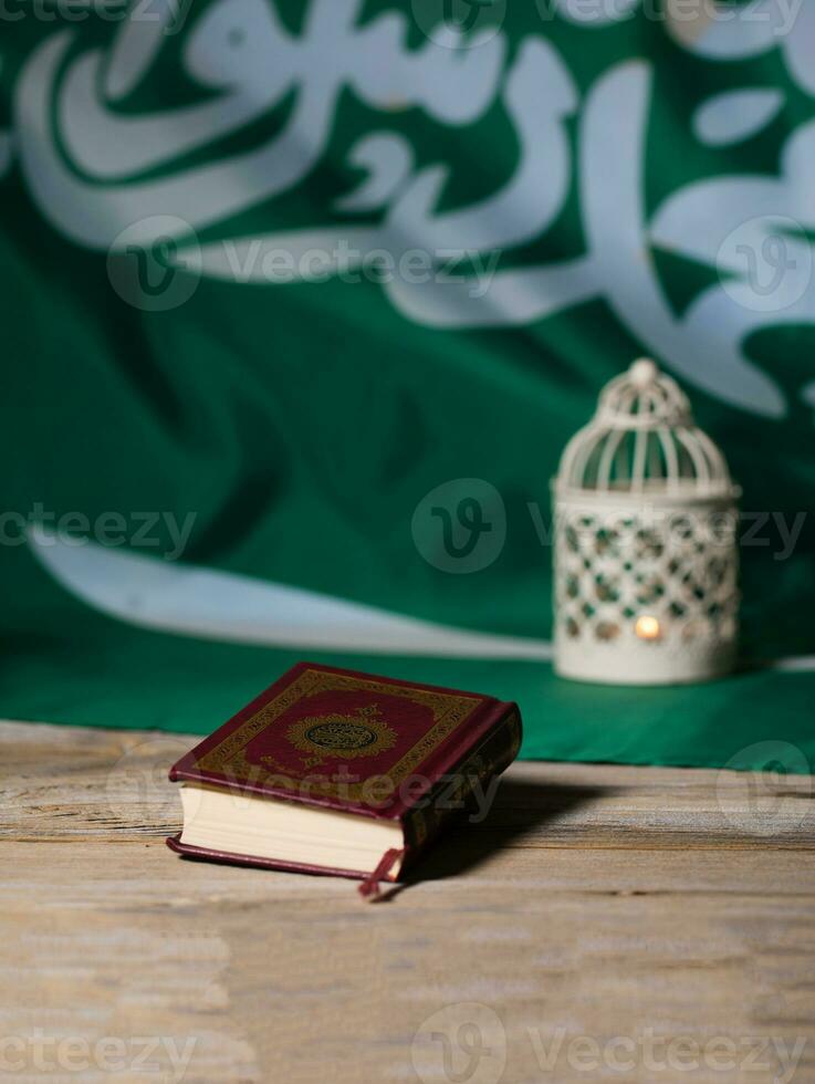 Sacred book of Quran on a wooden surface. photo