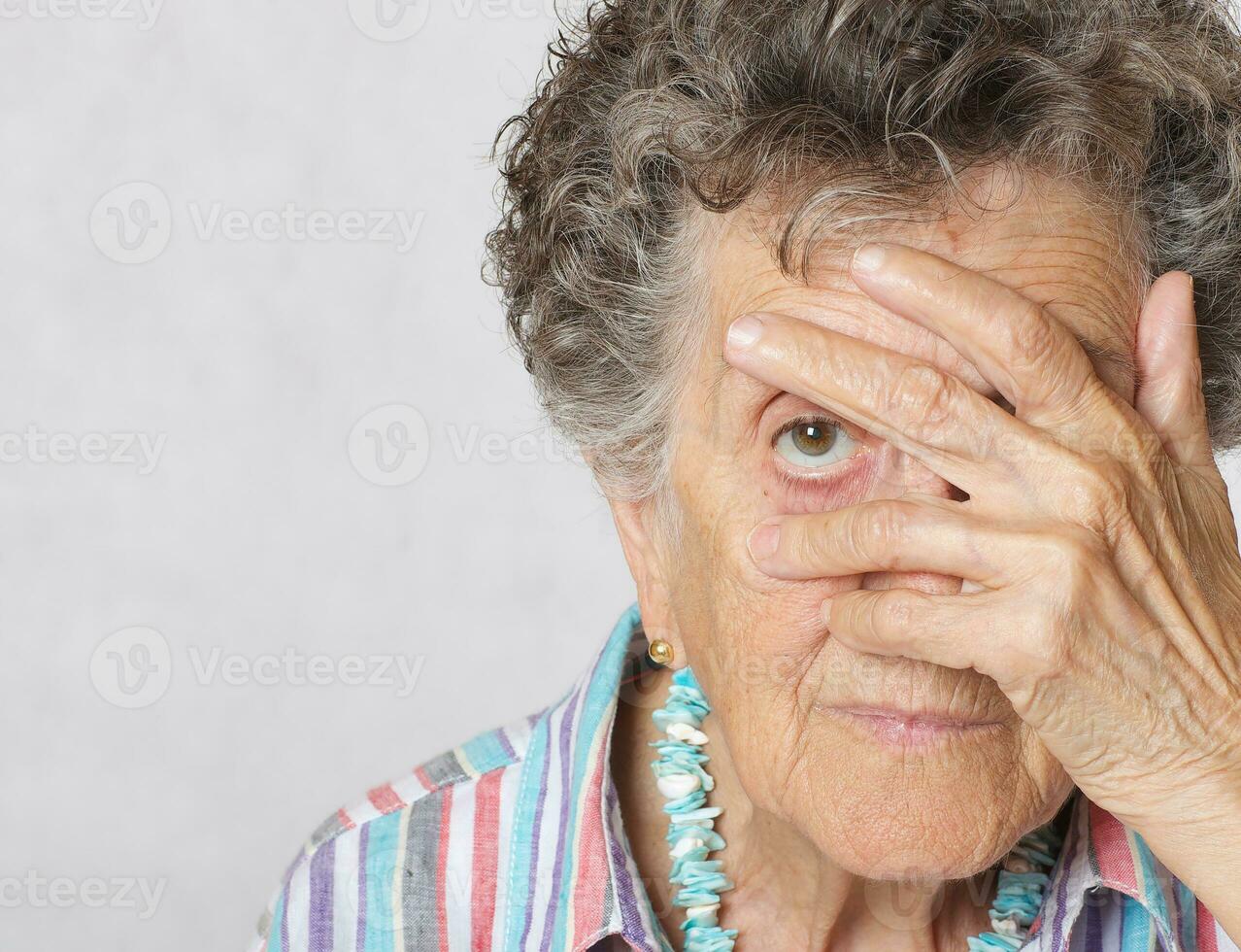 Senior woman show that her right are limited photo