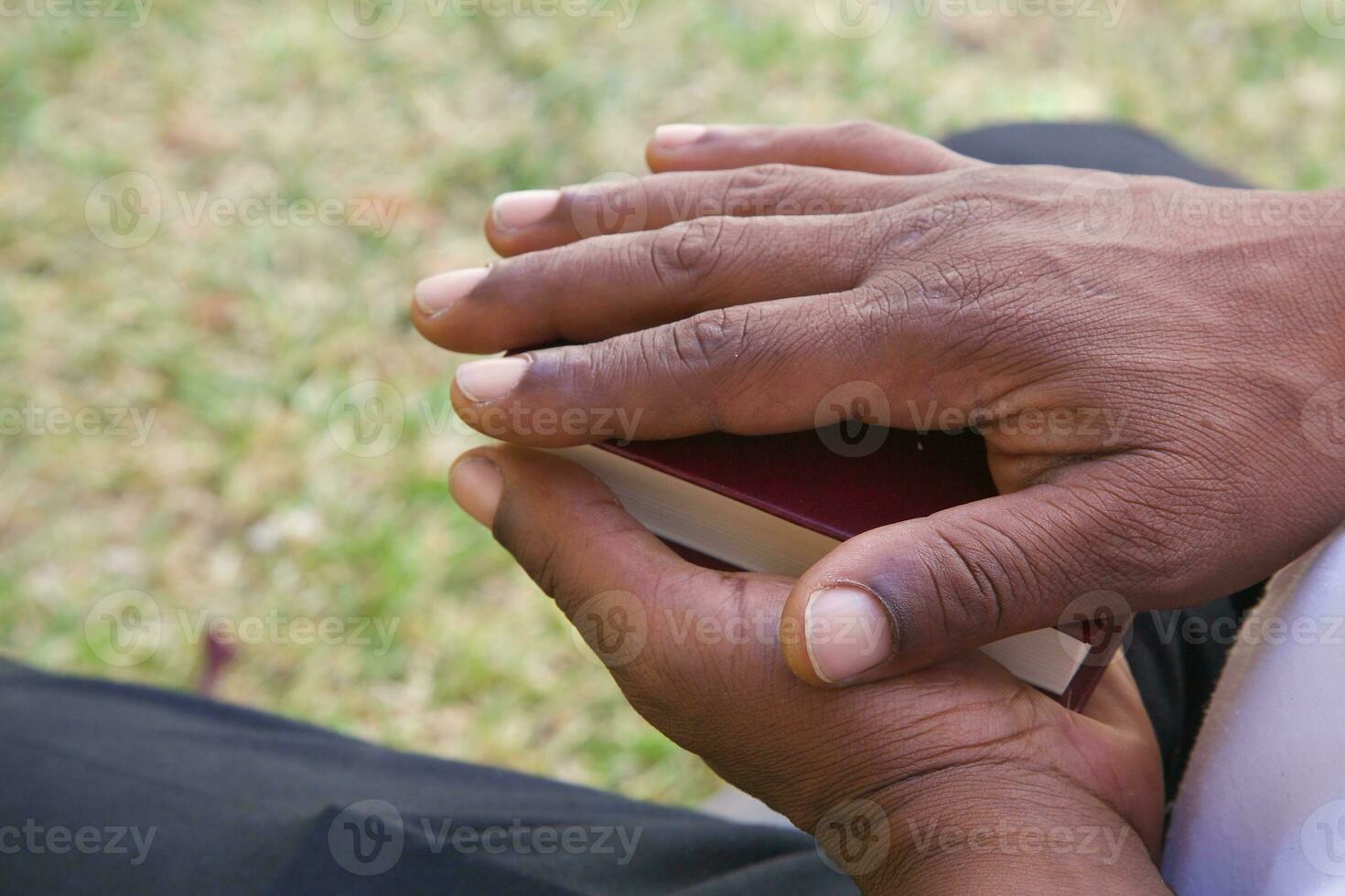 The hands on the Koran photo