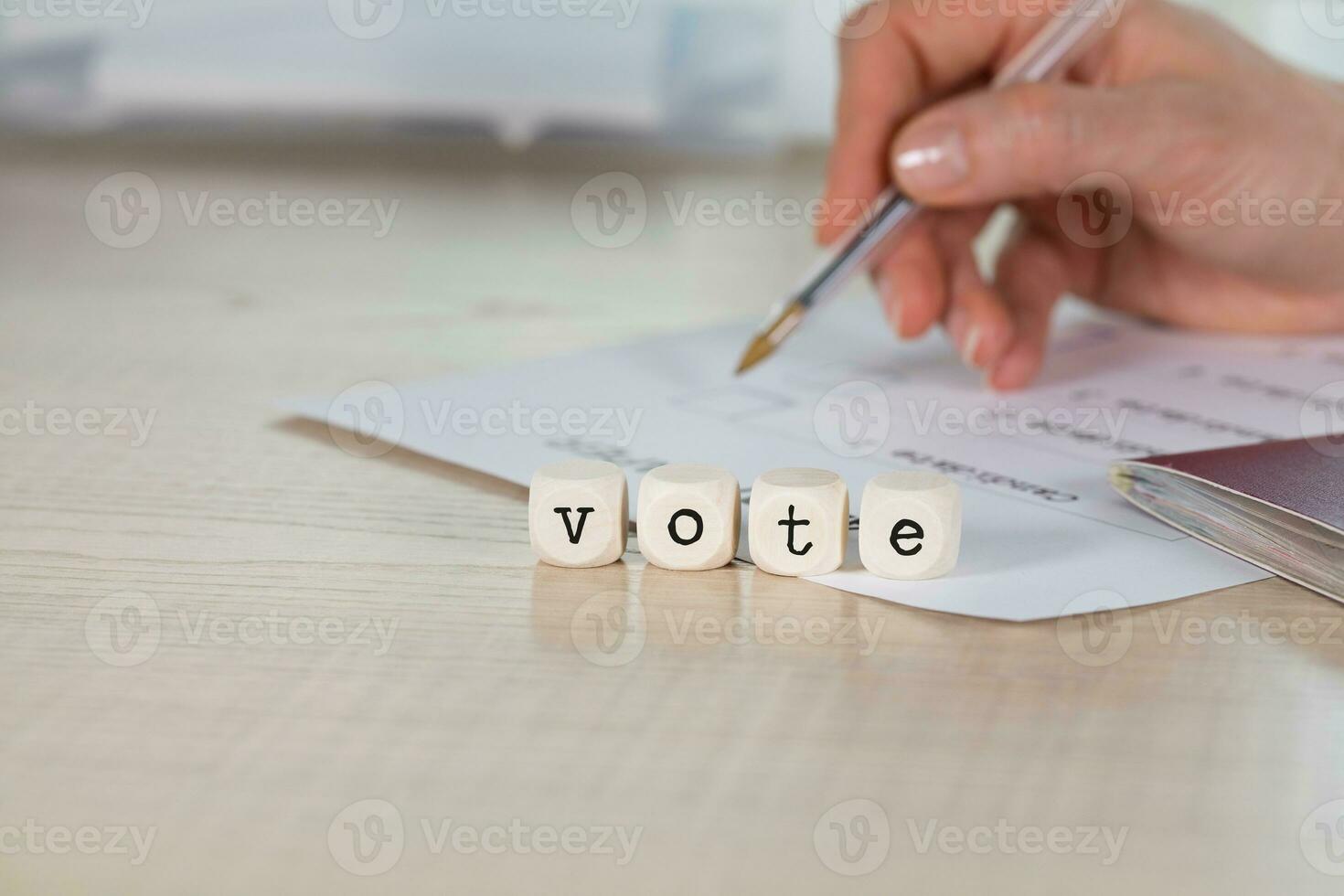 Word VOTE composed of wooden letters photo