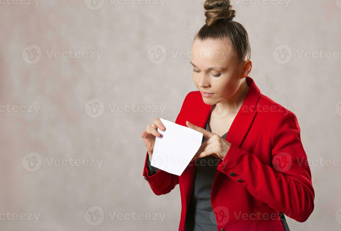 Young caucasian lady  keeps an envelope. Closeup photo