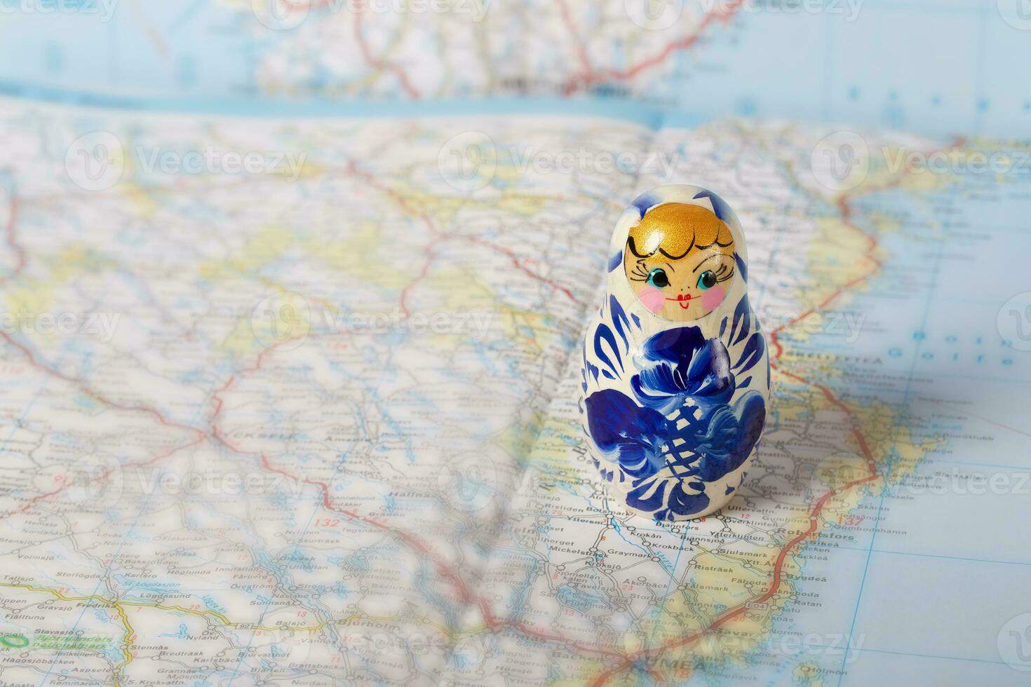 Russian matryoshka in gzhel style on a map. photo