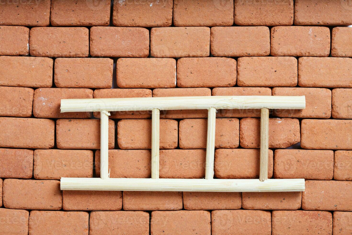 Ladder on a redbrick wall. Baackground. photo