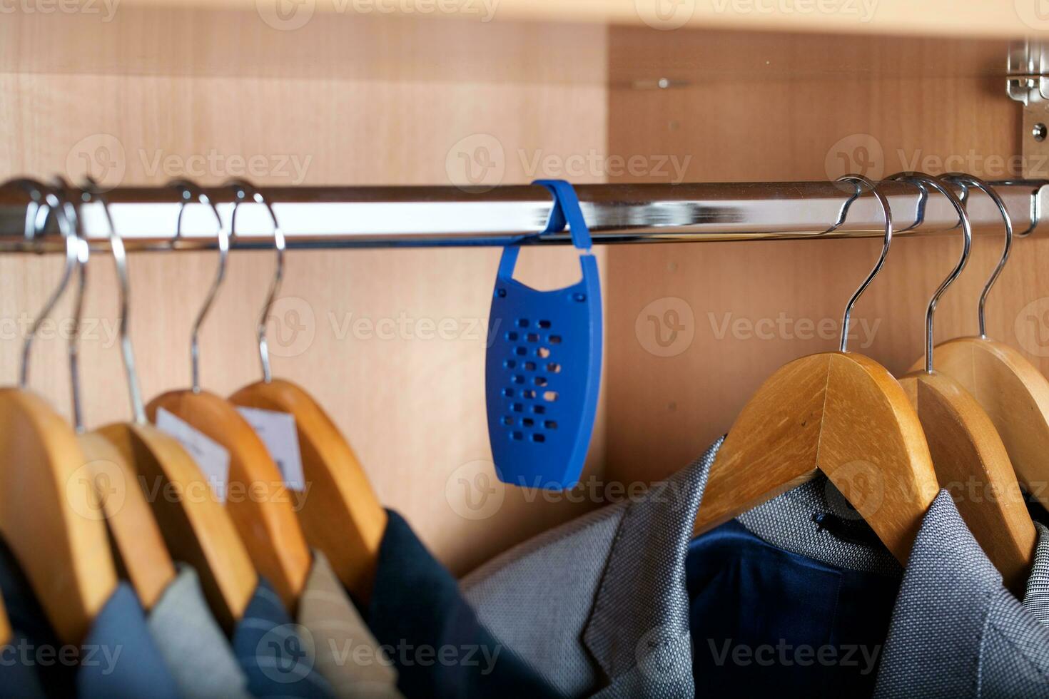 Open wardrobe of a business man. photo