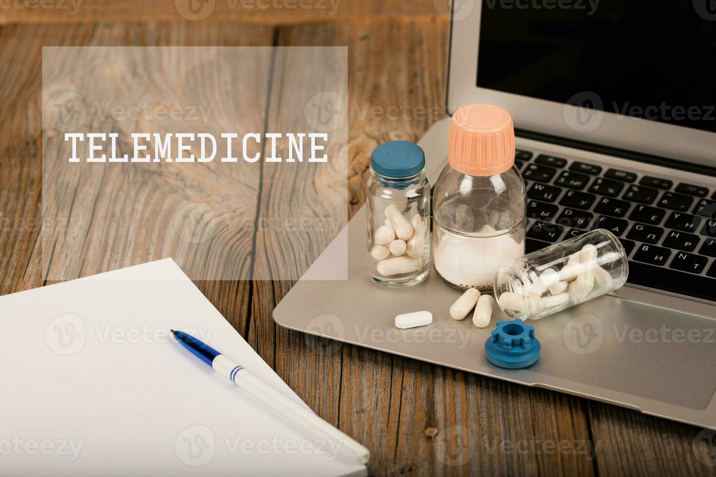 Word TELEMEDICINE. Prescriptions on the laptop. photo