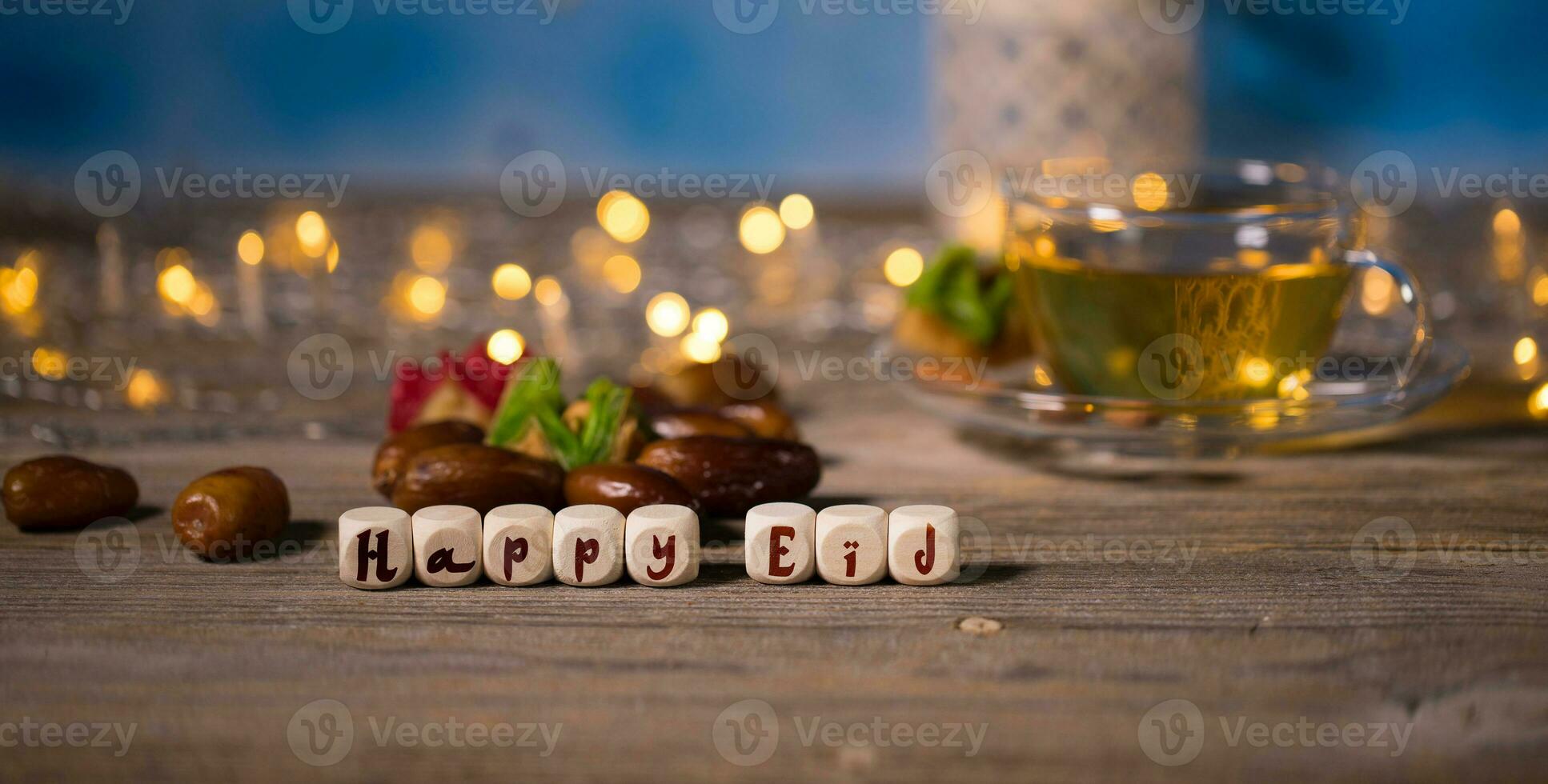 Congratulation HAPPY EID composed of wooden dices photo