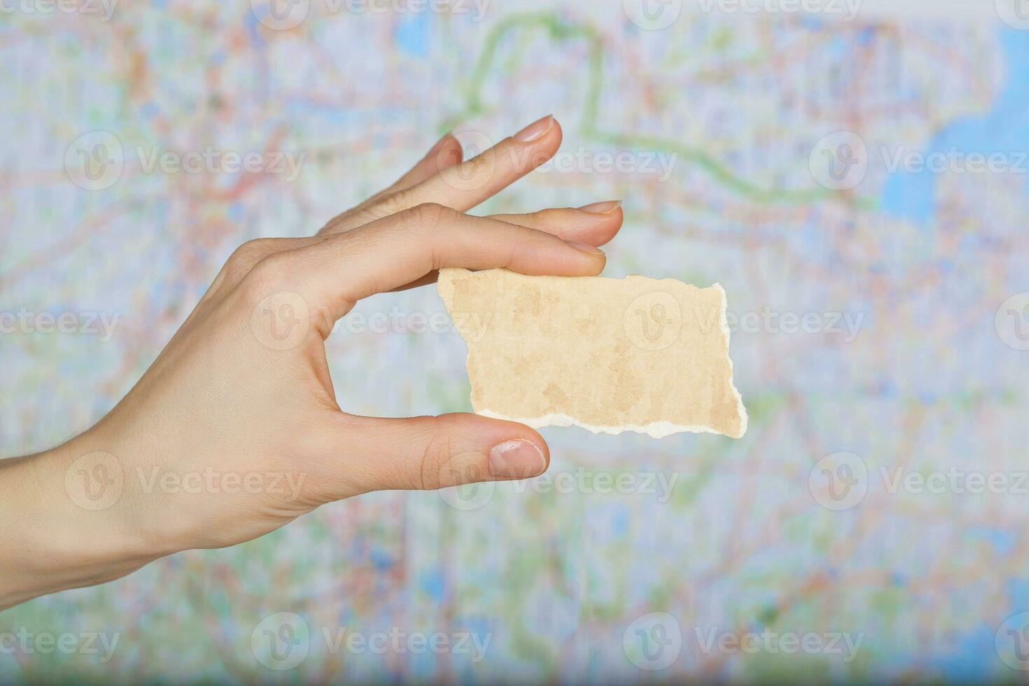 Piece of paper with free space for a text on a map. photo