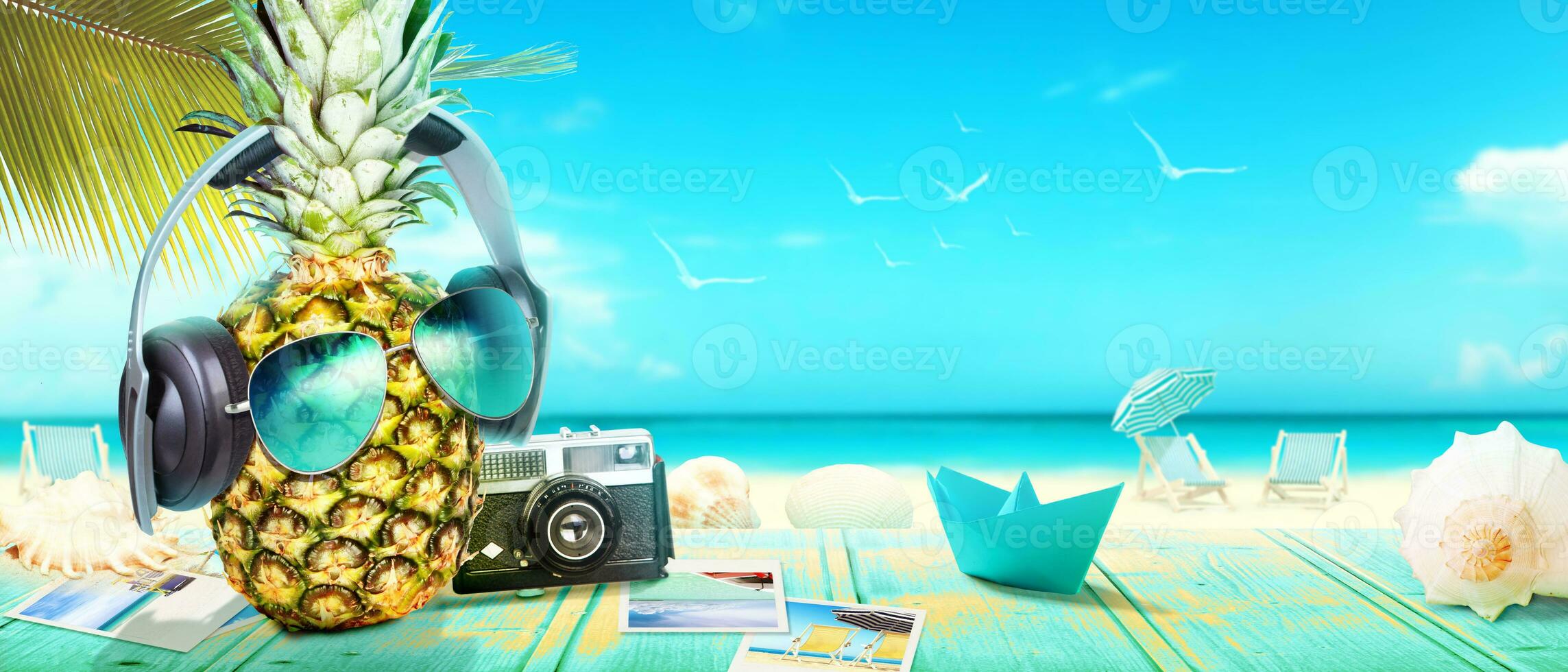 Creative pineapple with sunglasses on summer background. photo