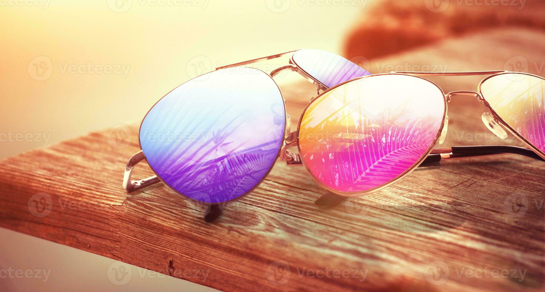 Summer tropical beach background with fashionable sunglasses. photo