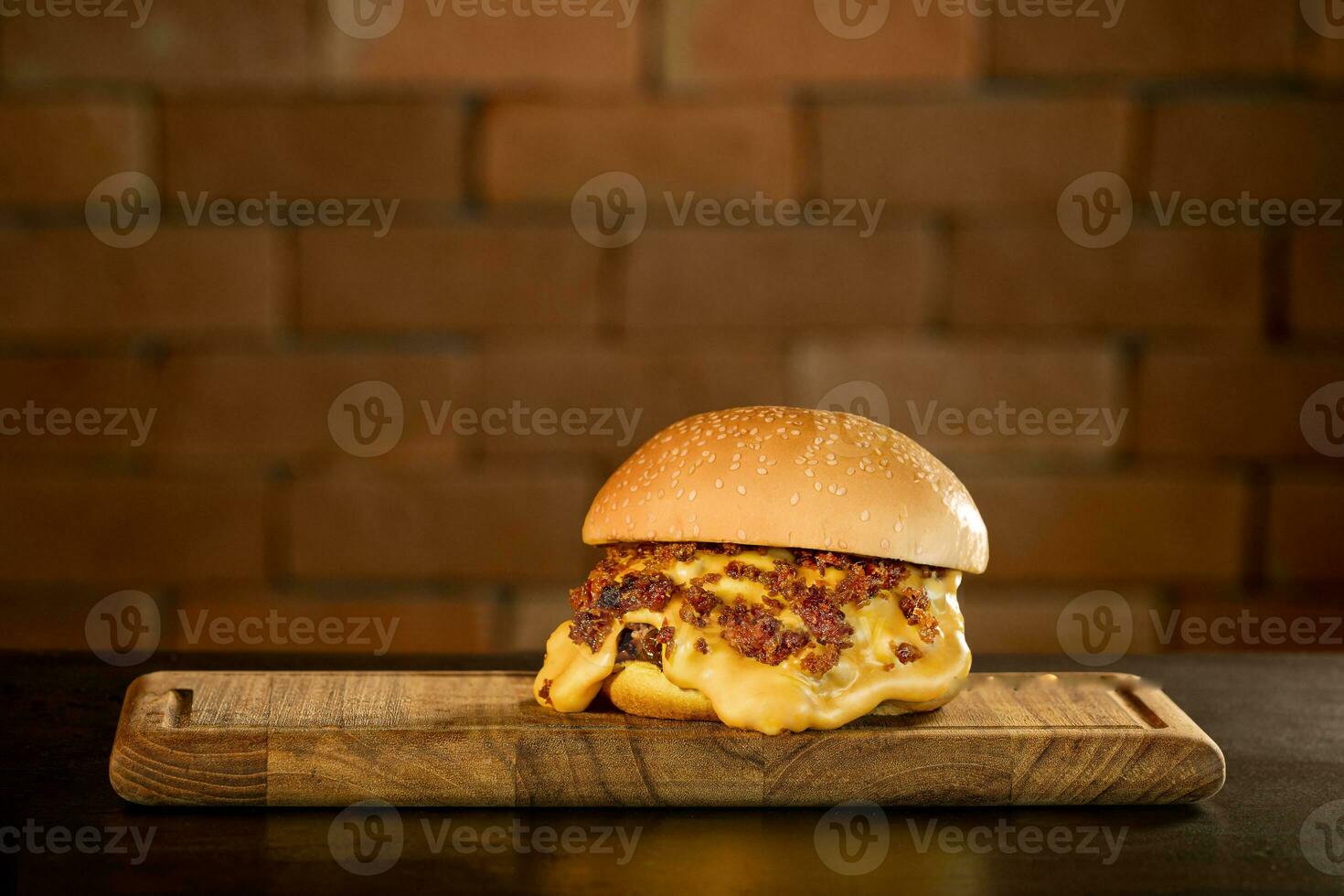 Delicious hamburger with cheese and bacon shooting in studio photo