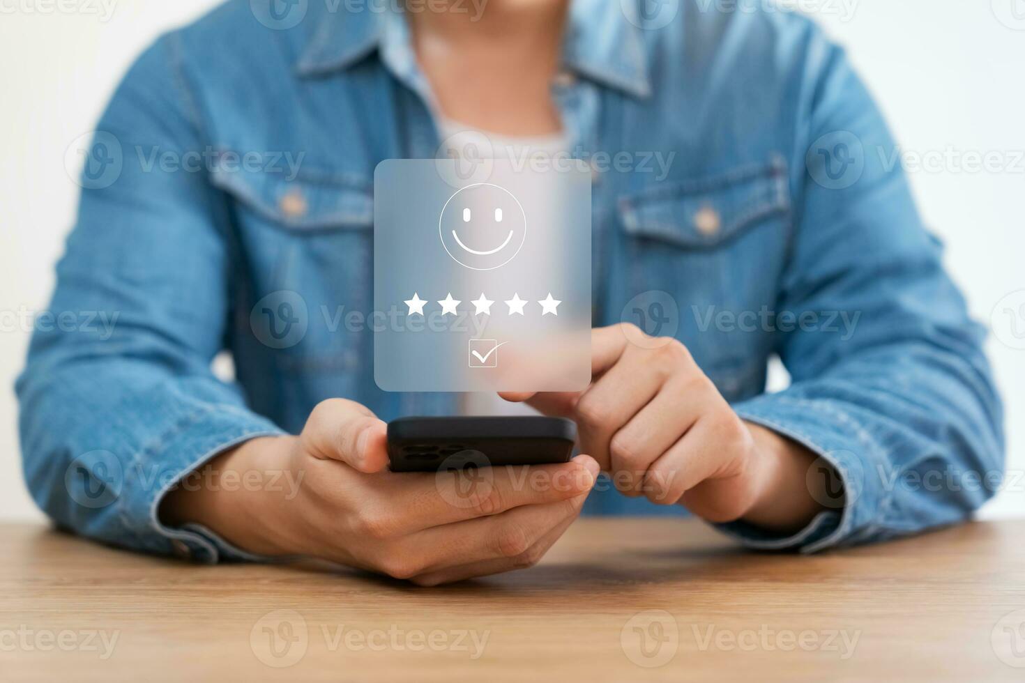 customer satisfaction survey concept business people use smartphone Touch the happy smiley icon. Satisfied. 5 stars. Service experience rating. online application Satisfaction Review best quality. photo