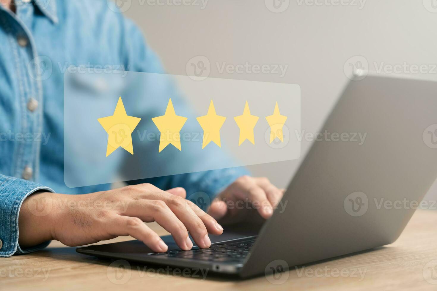 customer satisfaction survey concept business people use laptops Touch the happy smiley icon. Satisfied. 5 stars. Service experience rating. online application Satisfaction Review best quality. photo