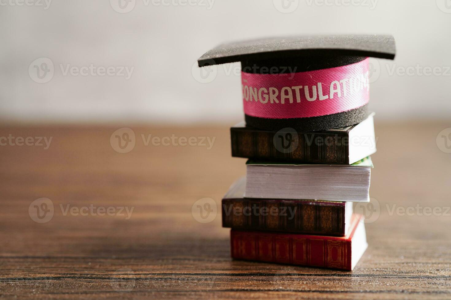 Graduation hat on book with copy space, learning university education concept. photo