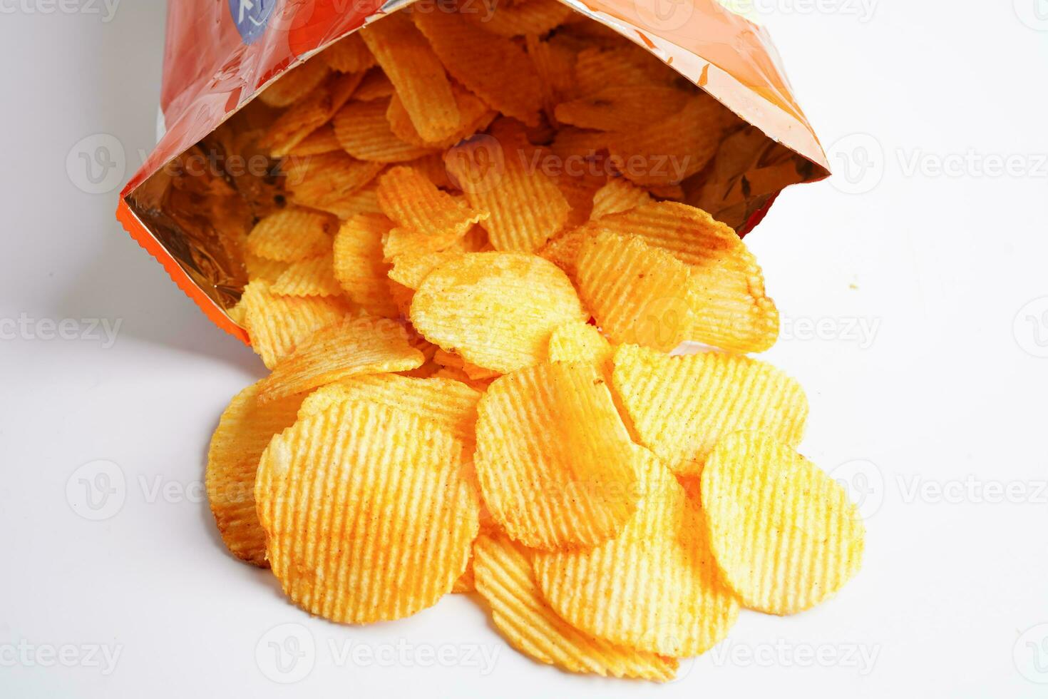 Potato chips in open bag, delicious BBQ seasoning spicy for crips, thin slice deep fried snack fast food. photo