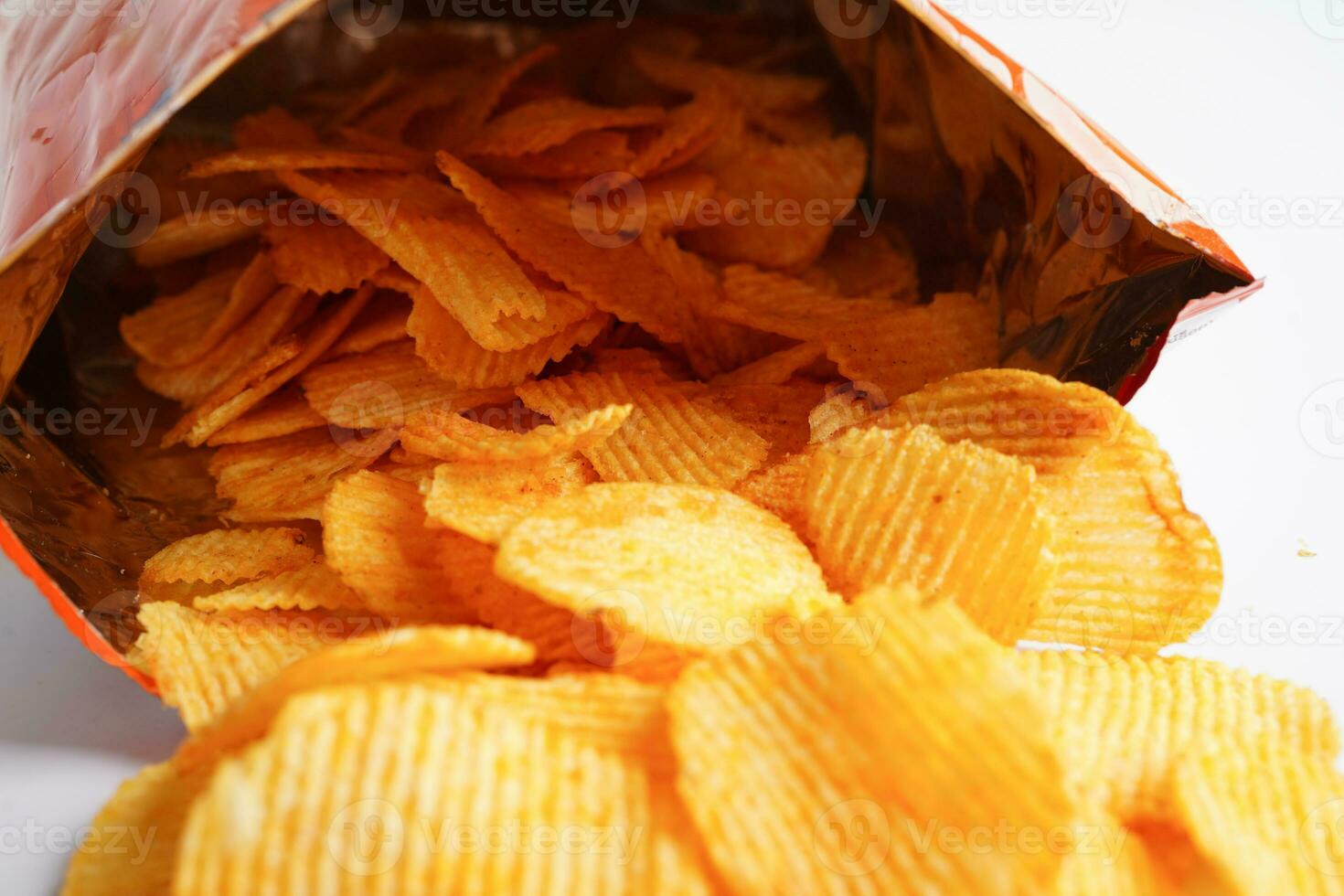 Potato chips in open bag, delicious BBQ seasoning spicy for crips, thin slice deep fried snack fast food. photo