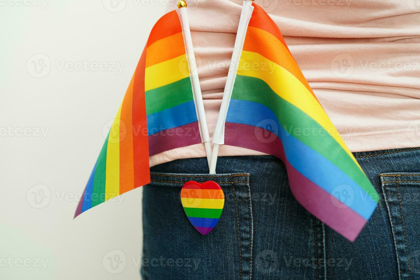 Asian woman with rainbow flag, LGBT symbol rights and gender equality, LGBT Pride Month in June. photo