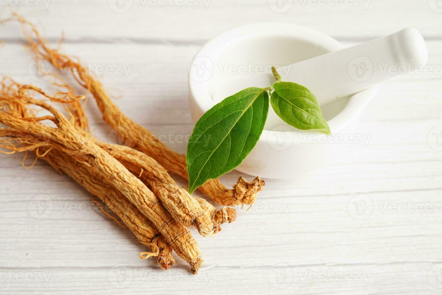 Ginseng roots and green leaf, healthy food. photo