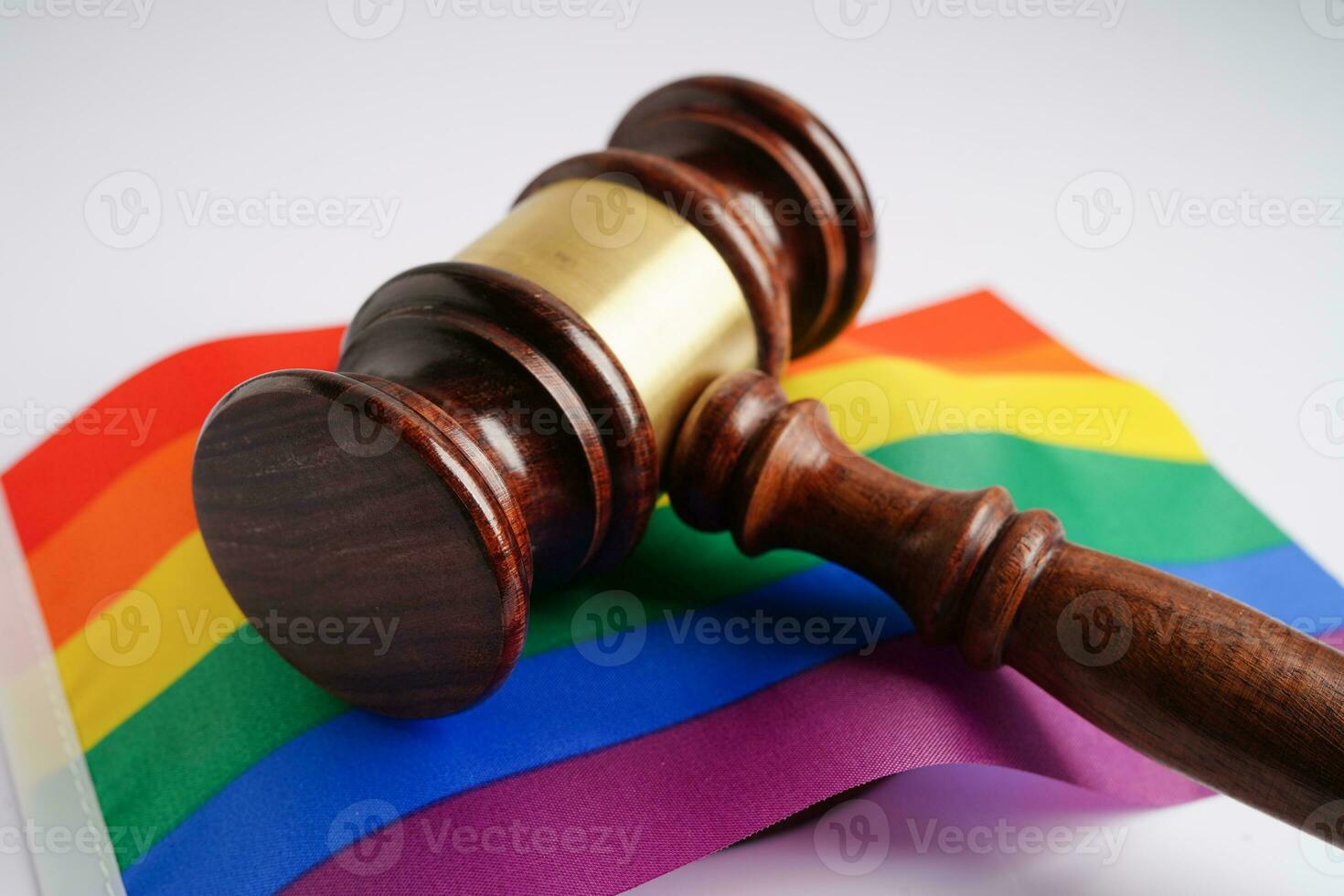 Gavel for judge lawyer with heart rainbow flag, symbol of LGBT pride month. photo