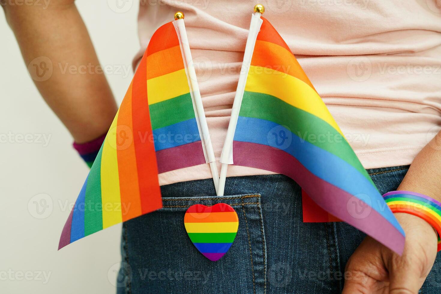 Asian woman with rainbow flag, LGBT symbol rights and gender equality, LGBT Pride Month in June. photo