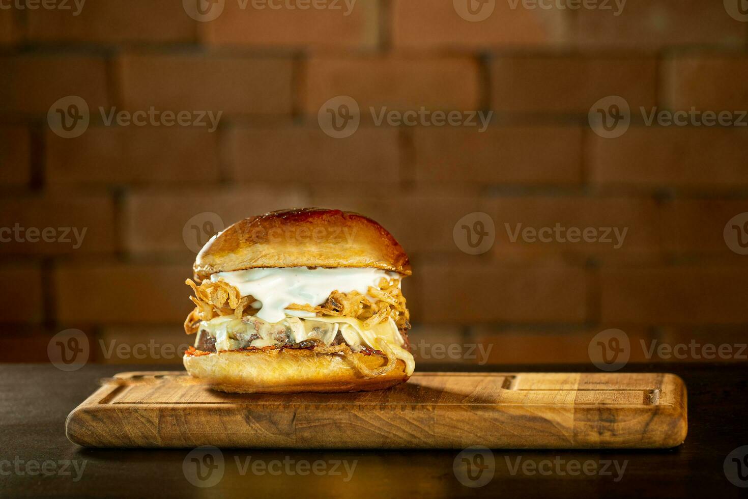 Delicious hamburger with cheese and bacon shooting in studio photo