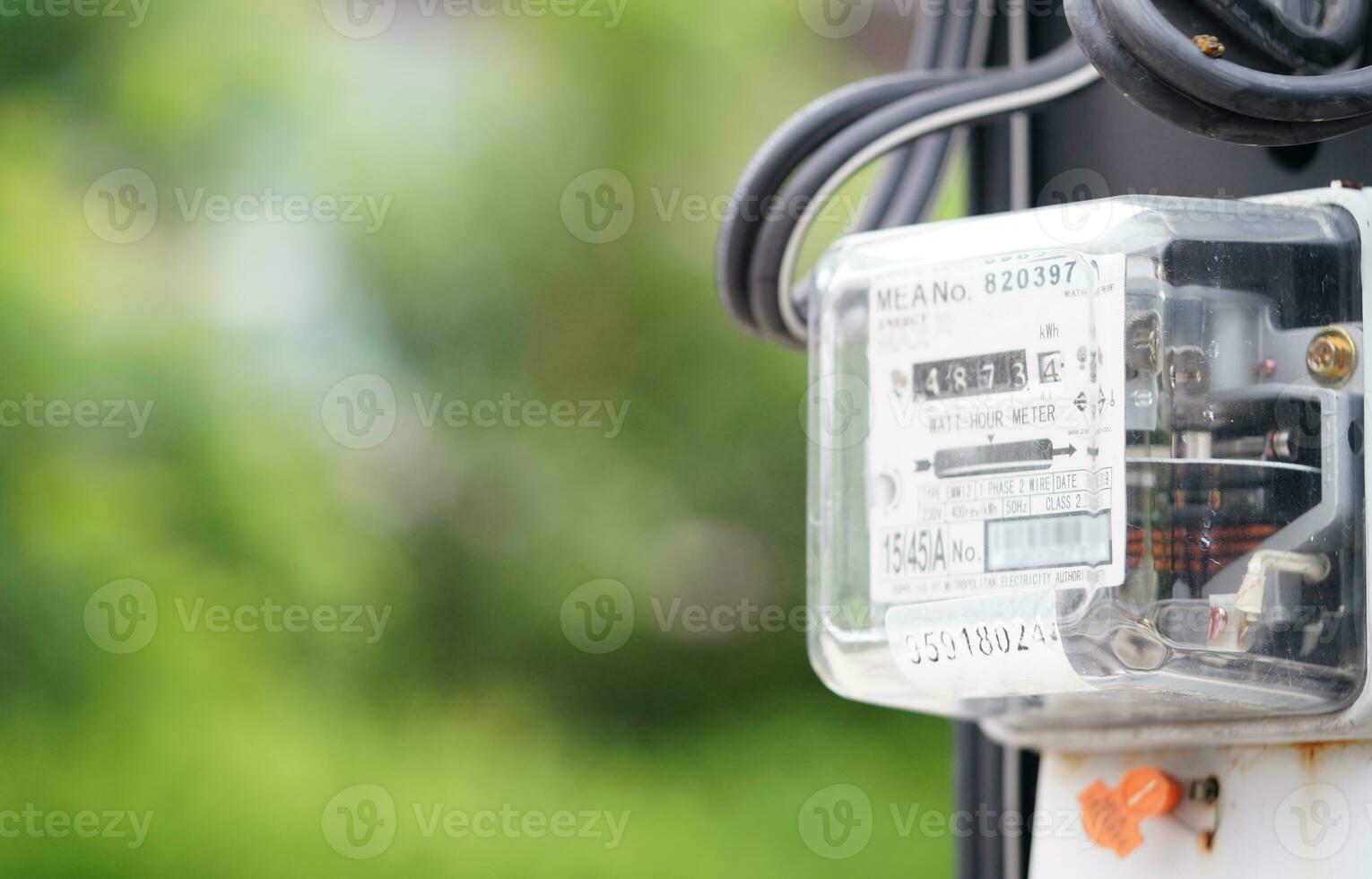 Electric measuring power meter for energy cost at home and office. photo