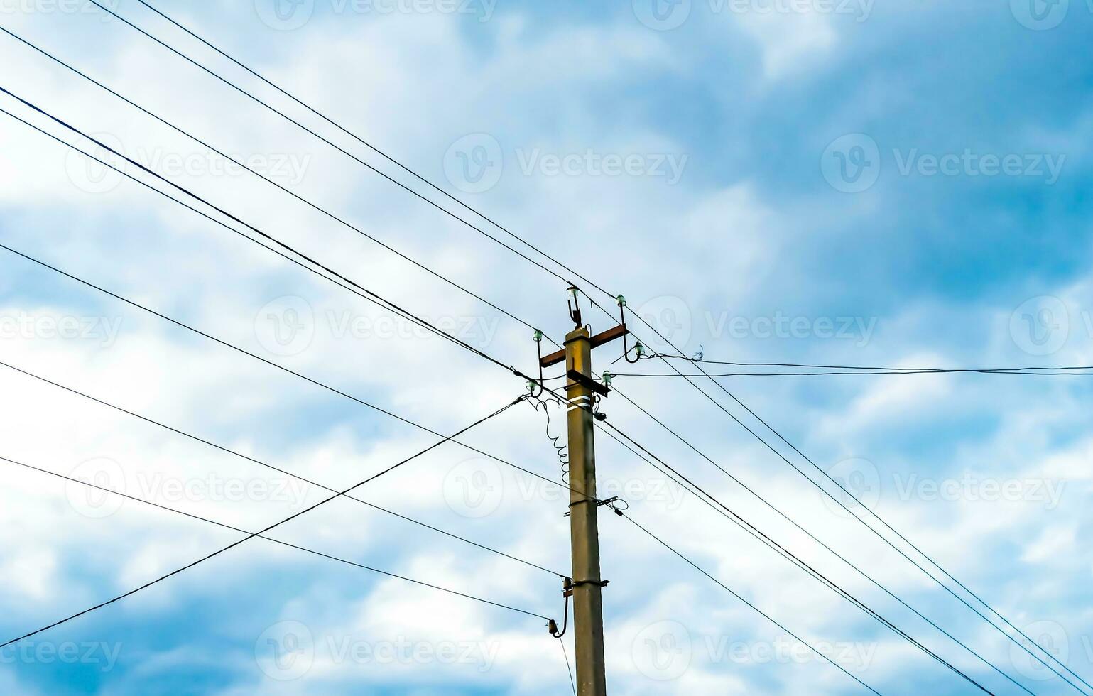 Power electric pole with line wire on colored background close up photo