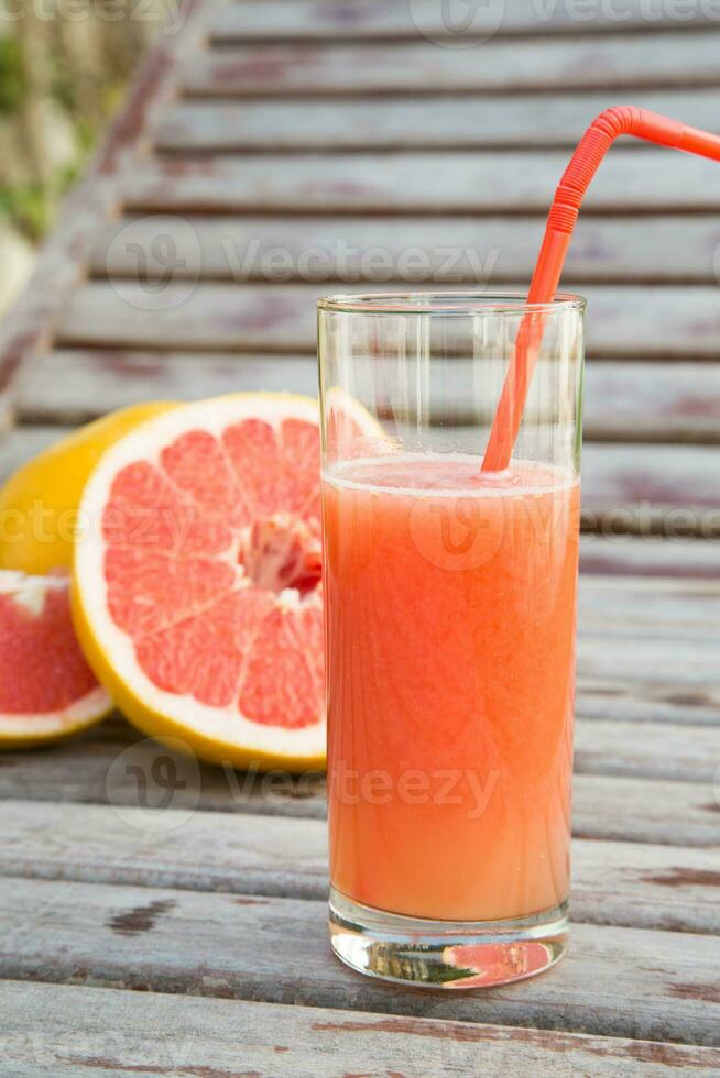 A glass of fresh grapefruit  juice photo