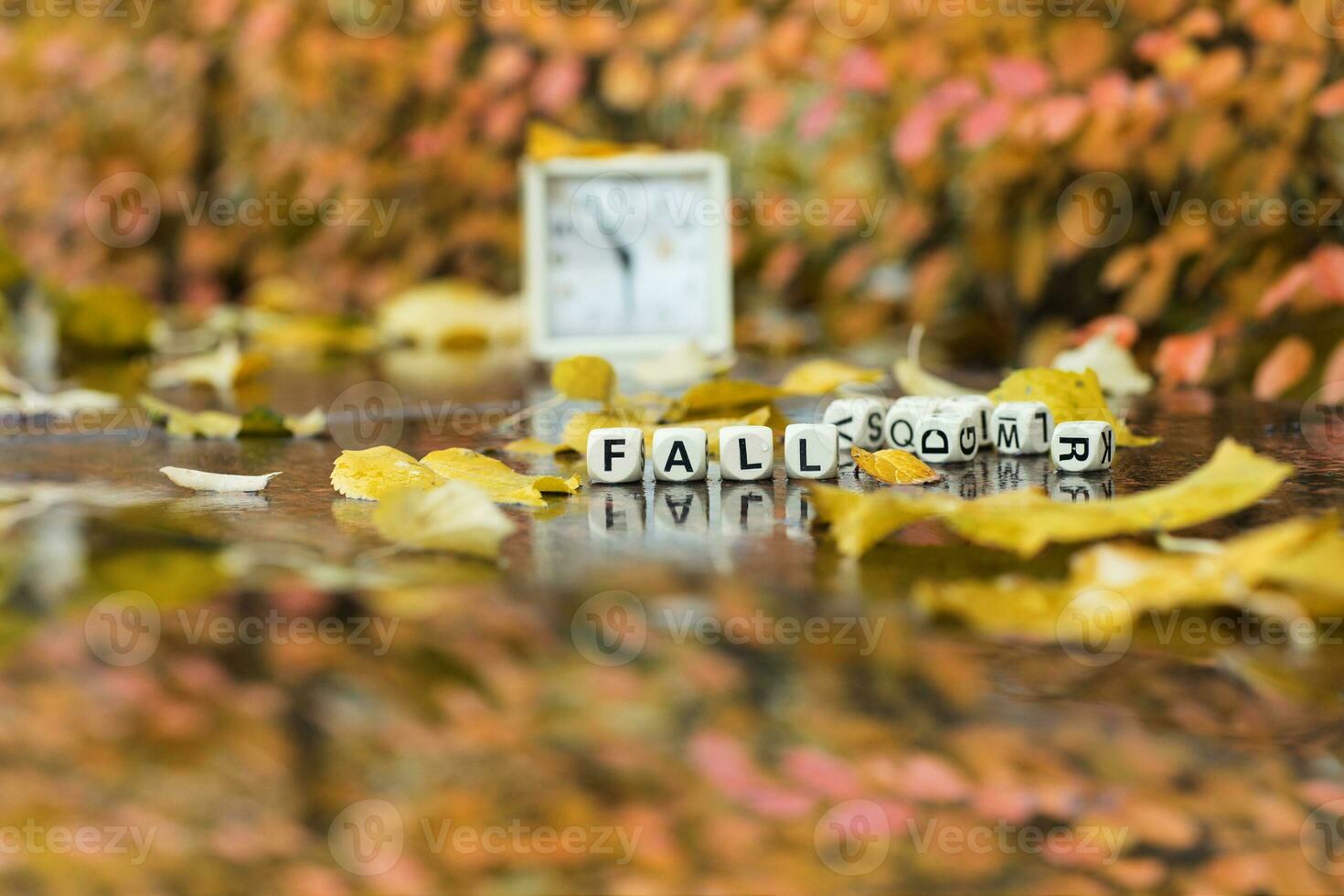 Word FALL is composed of wooden letters. photo