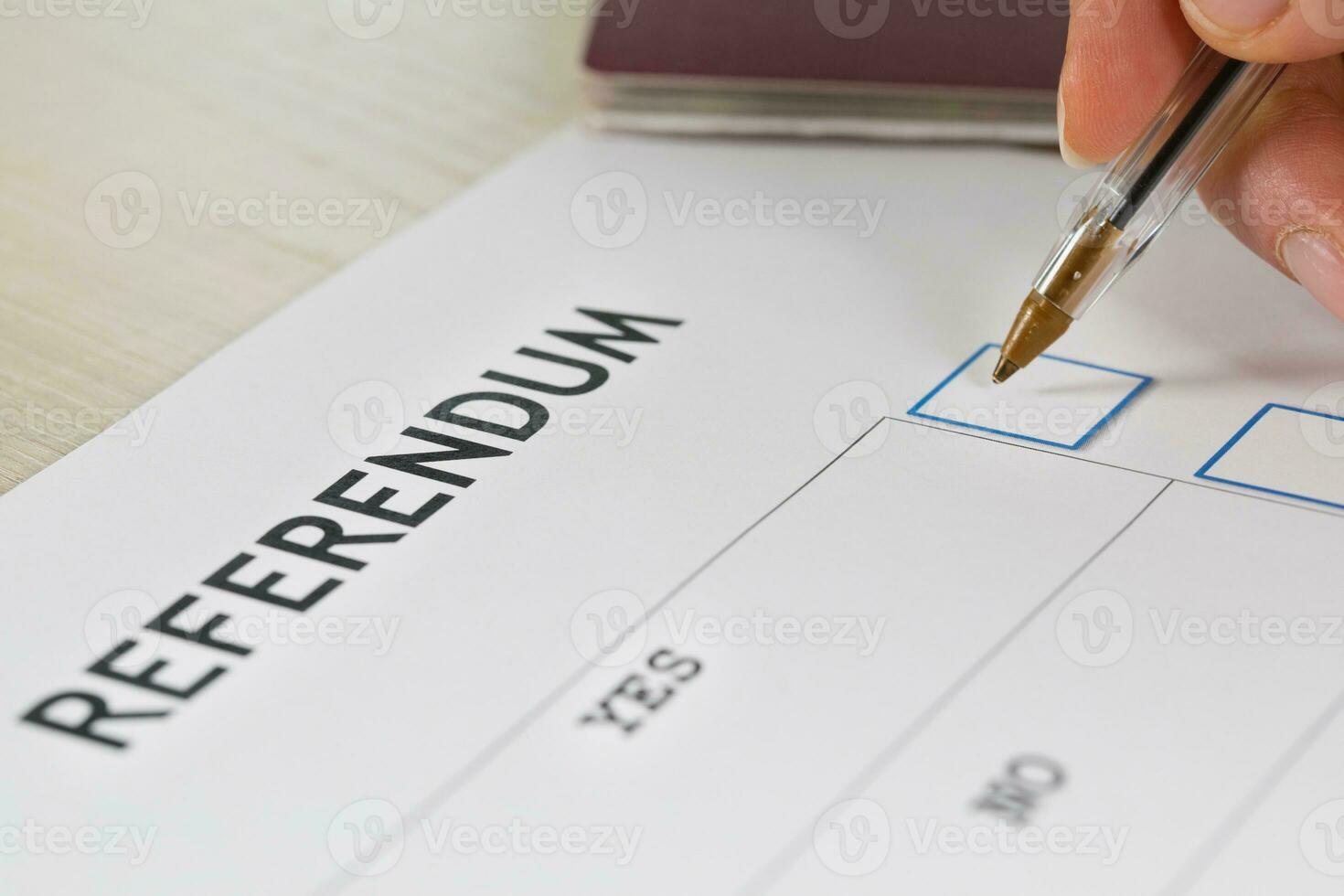 Referendum ballot paper, black pen, and passport on the table. photo