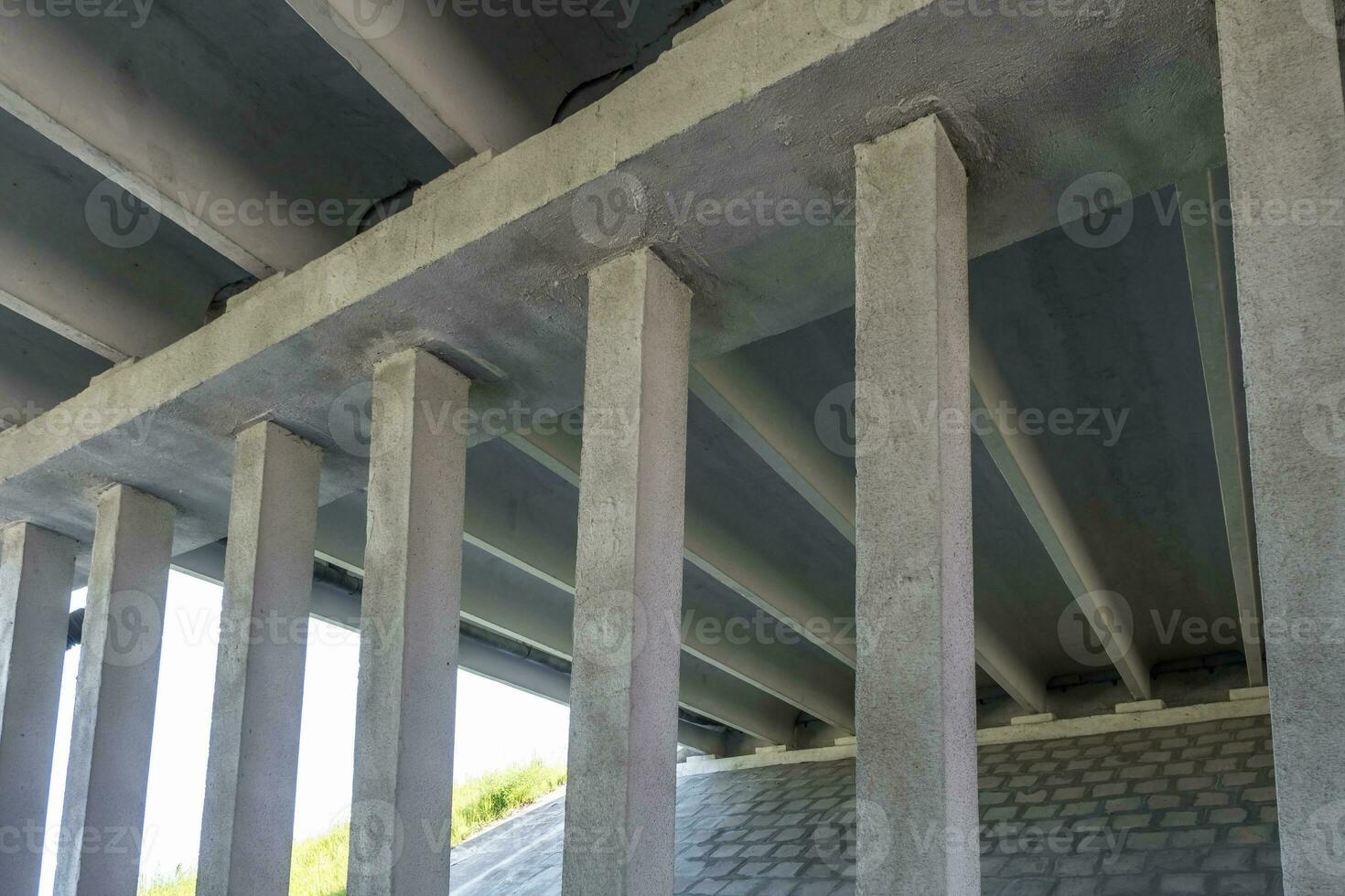 concrete columns like pillars of an automobile bridge photo