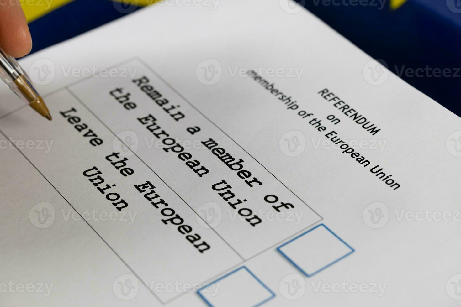 EU Referendum ballot paper, black pen, and passport on the table. photo