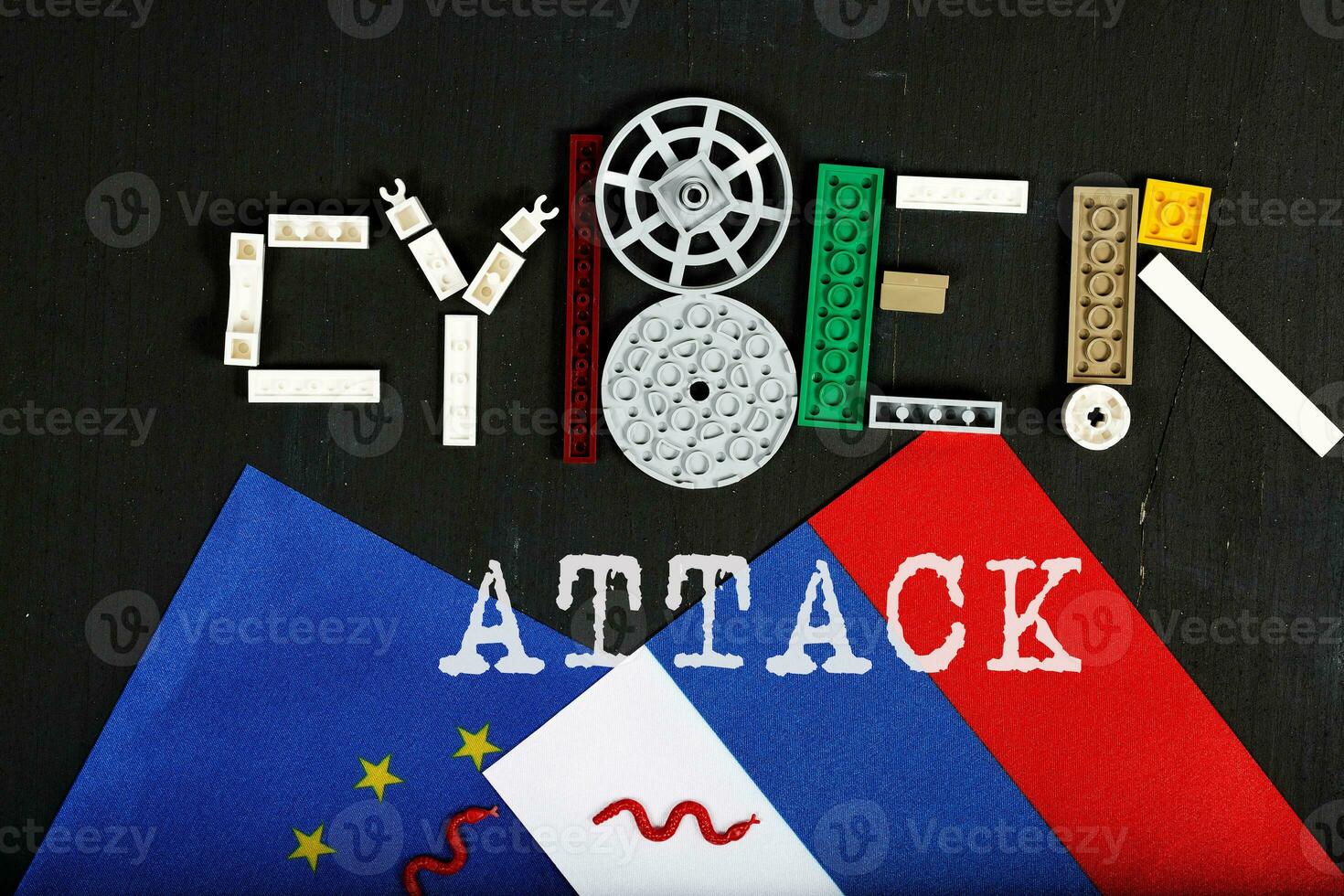 Cyber-attack is composed of plastic mini block on a black surface. Background photo