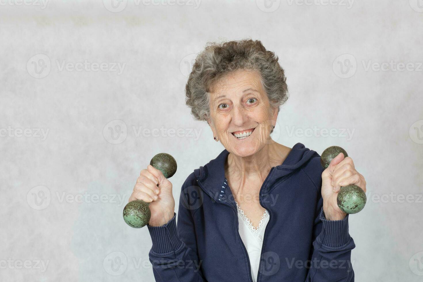 Senior woman is dressed in a sport costume photo