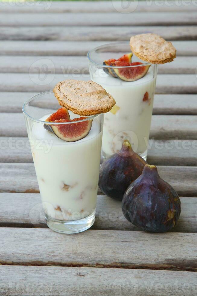 Ricotta cheese dessert with fresh pieces of fig and crispy homemade biscuits photo