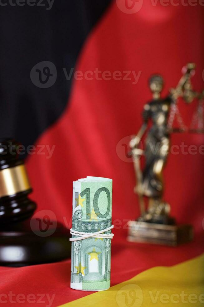 Pile of 100 euros on a German flag photo