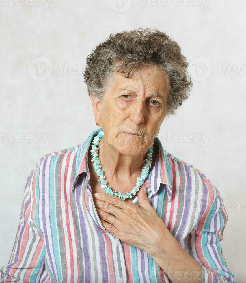 Old woman has a feeling of suffocation photo