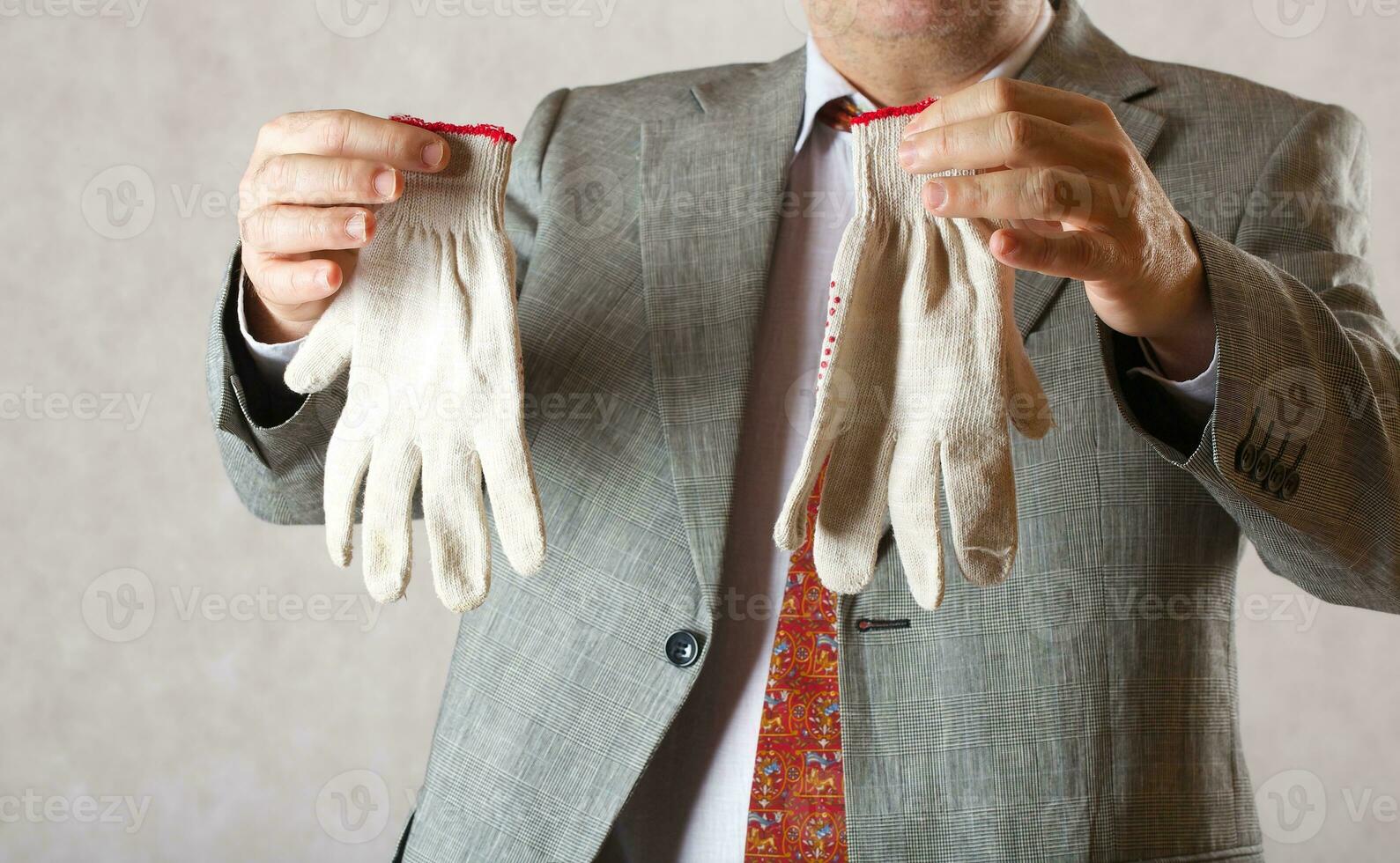 Gardening gloves in the hands of a man photo