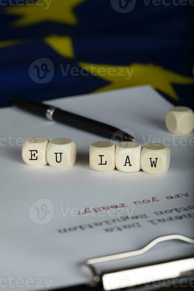 Word EU LAW composed of wooden dices. photo