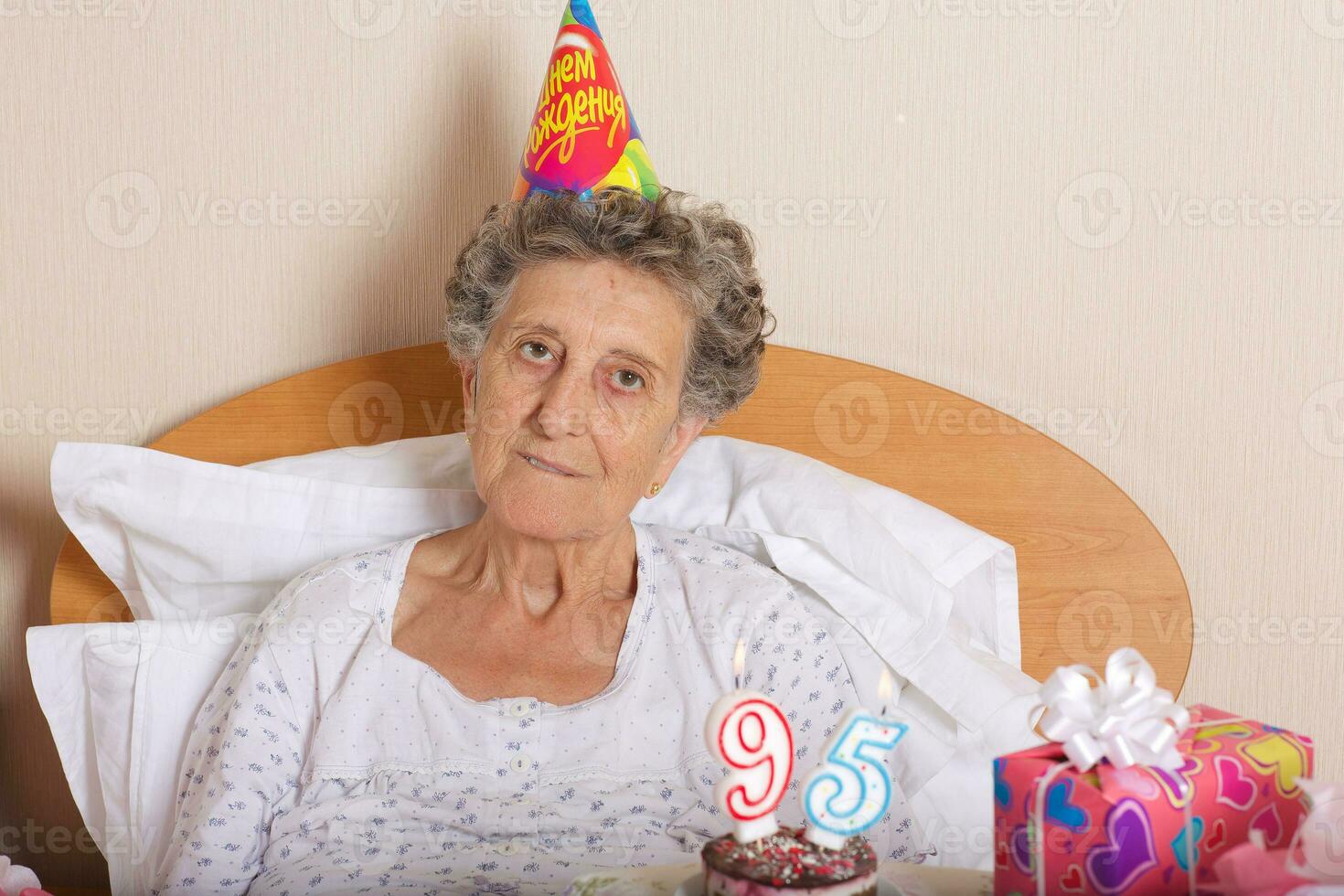 Old woman celebrates her birthday photo