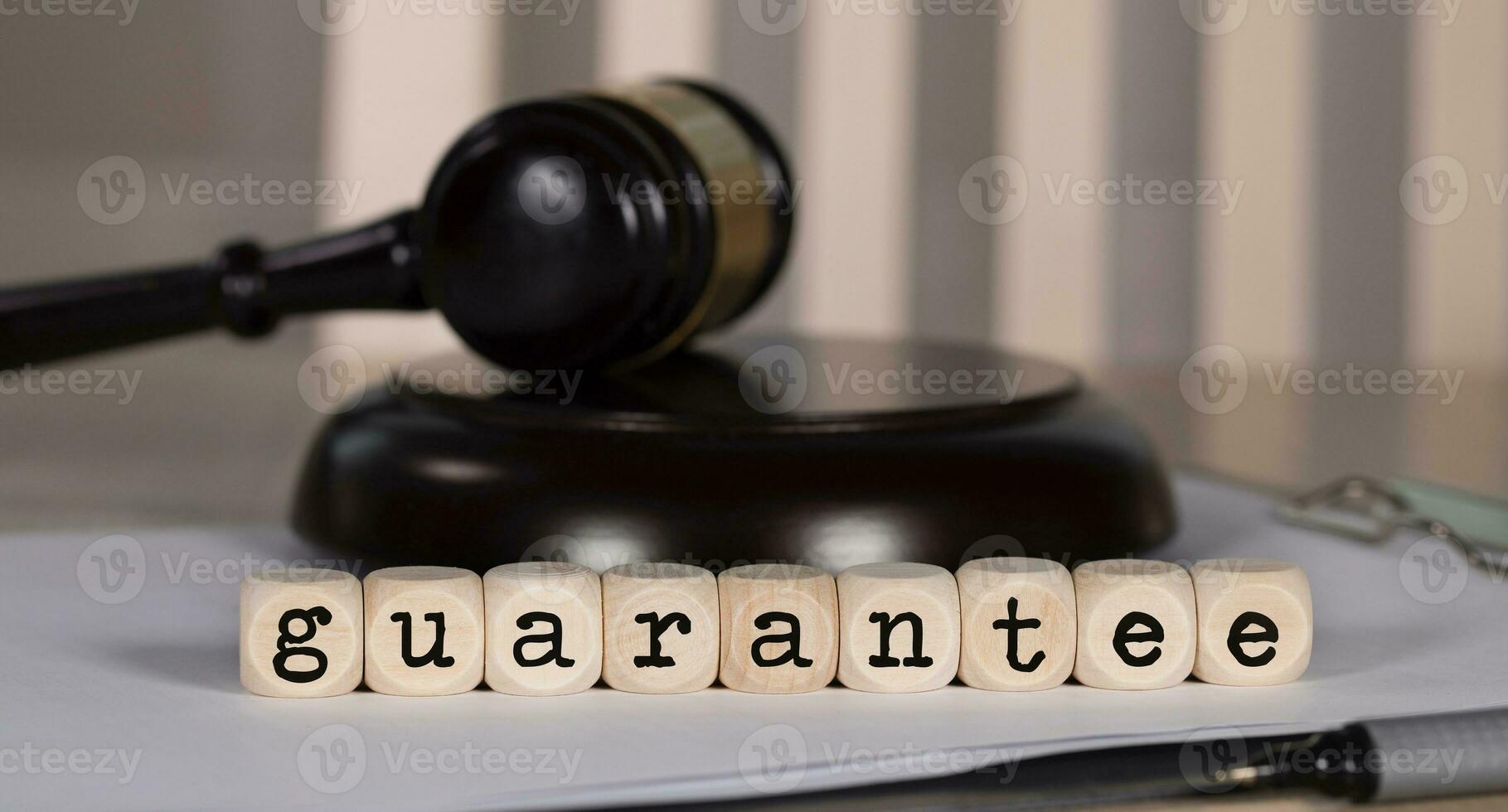 Word GUARANTEE composed of wooden dices. photo