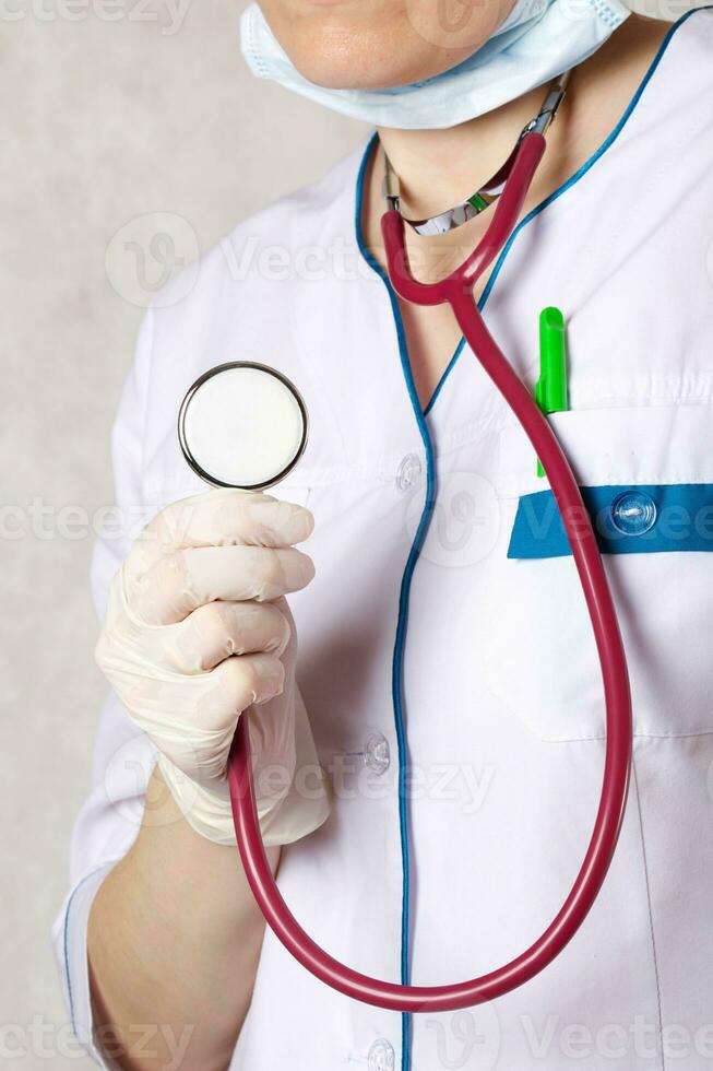 A professional stethoscope in the hand of a doctor. Closeup photo