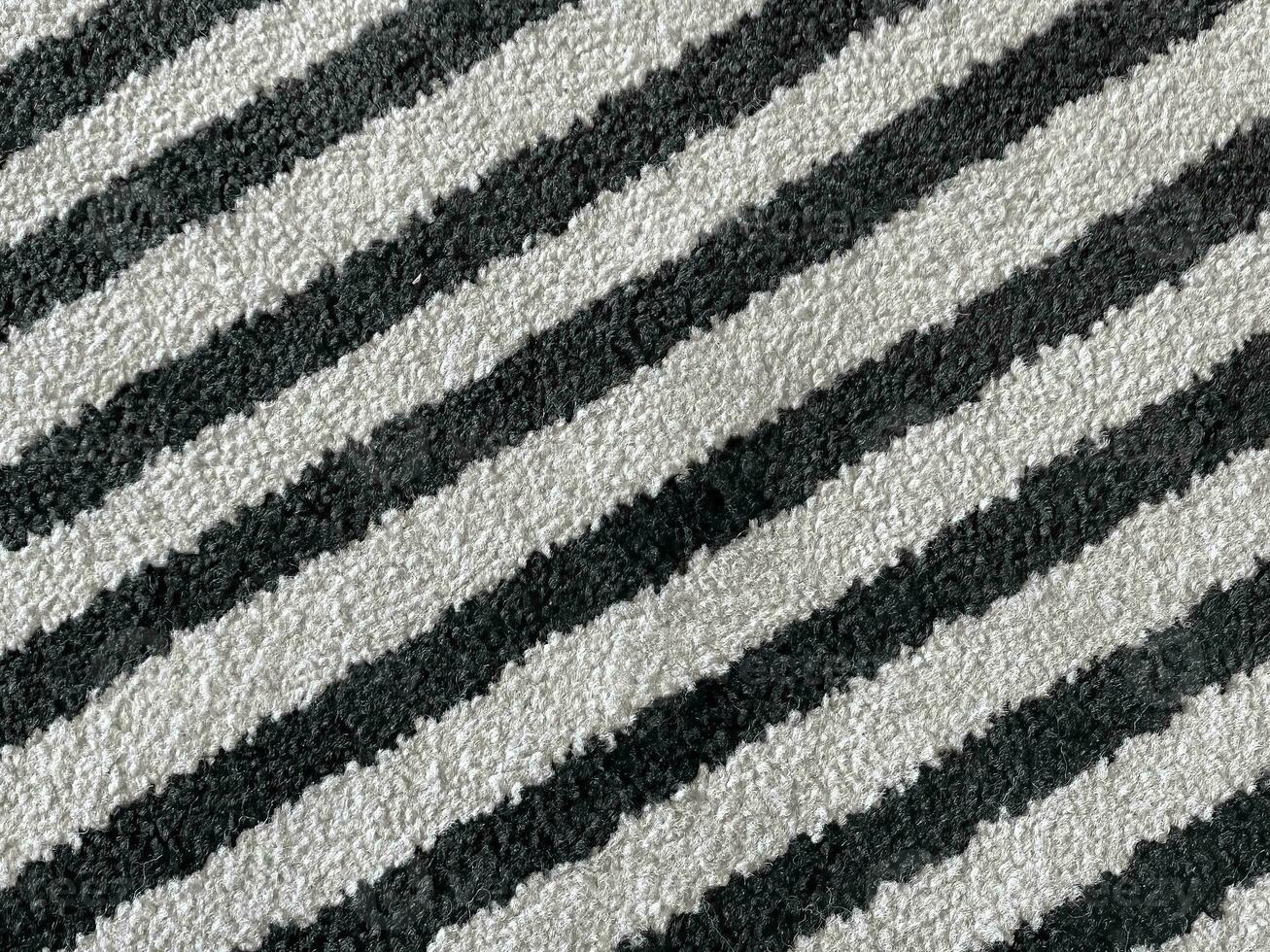 white rug or carpet stripe pattern with black stripes. texture background black and white nobody.abstract texture background. photo